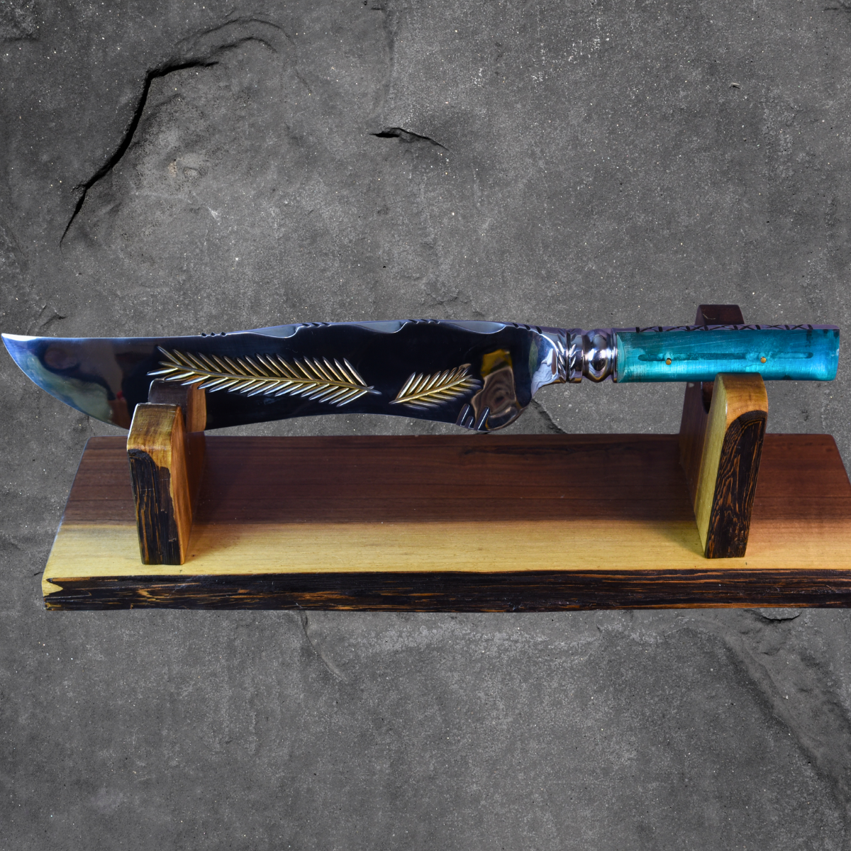 Decorative knife with a blue handle on a wooden stand against a gray background