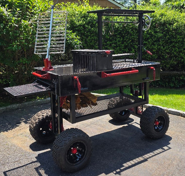 Portable barbecue grill with wheels on a driveway