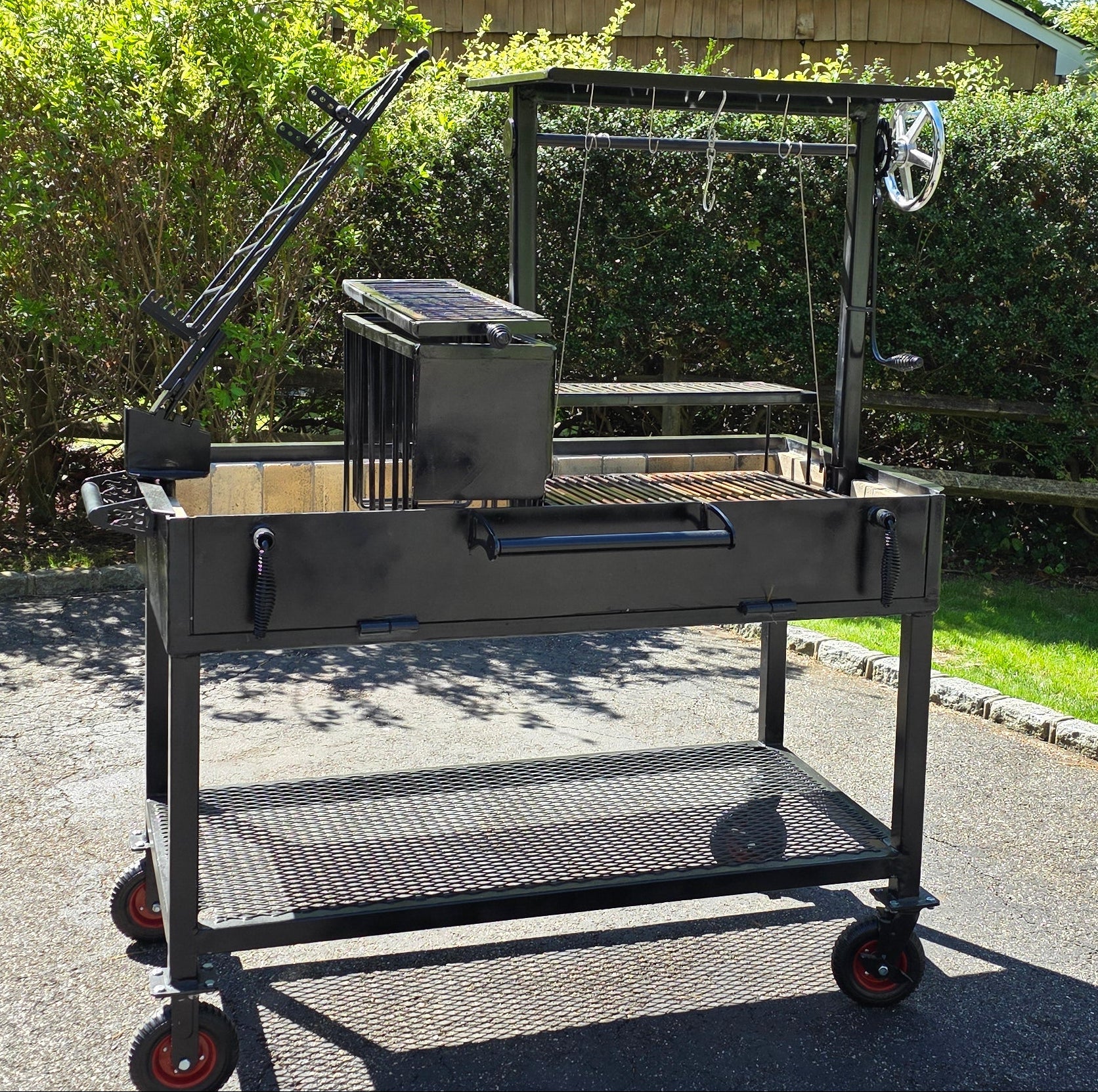 Outdoor Santa Maria grill cart with various attachments 