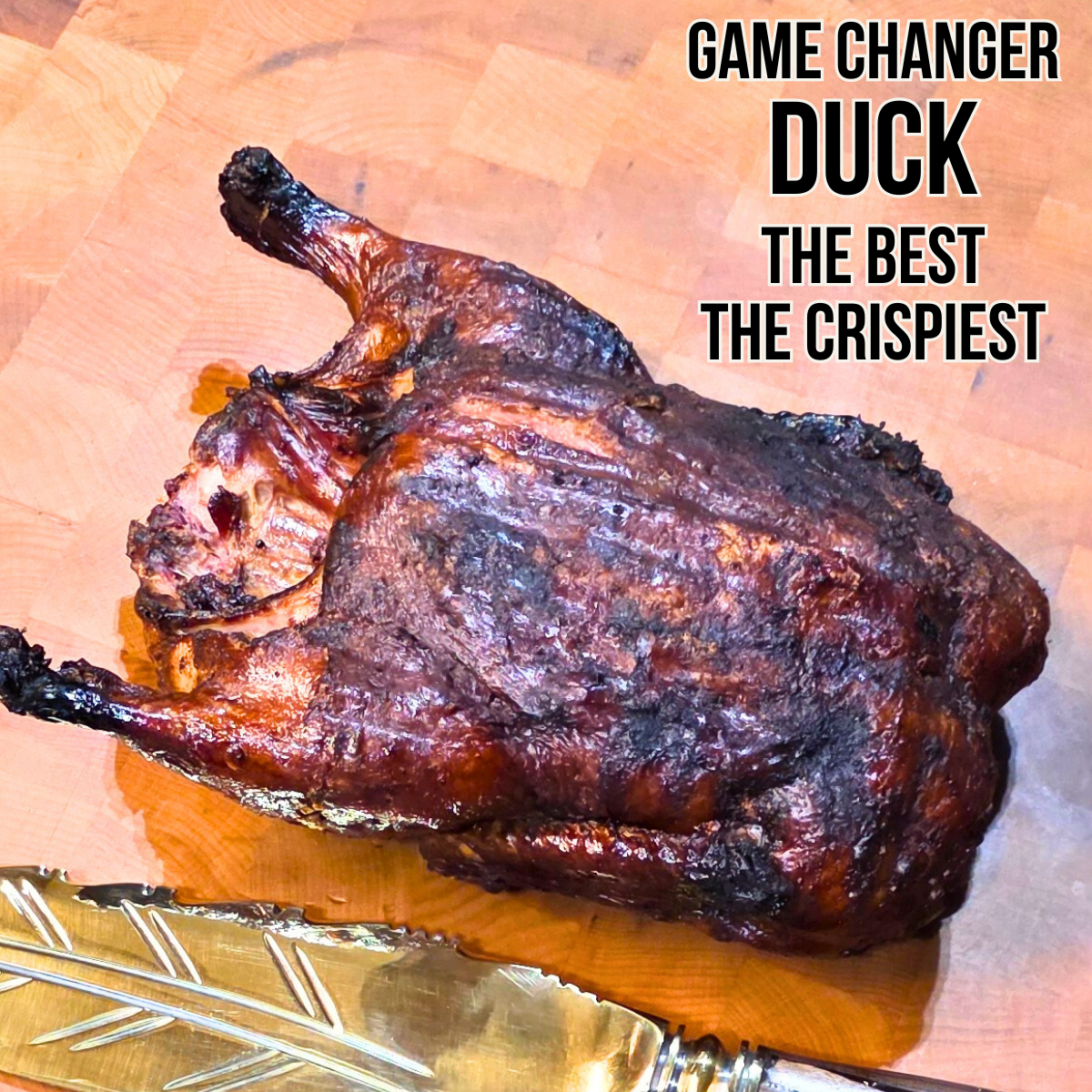 Whole crispy roasted duck from viral r/cooking Reddit post by Executive Chef Mike Riddle achieving over 400k views demonstrating professional fire-roasting technique and heat mastery
